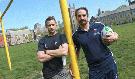 U of T rugby coach Paul DiCarmine on the right and Assistant coach, Matt Hodgson on the field that there rugby teams have played for years at the University of Toronto in Toronto on May 15. They are losing the field to field hockey.