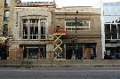 SUE REEVE sue.reeve@sunmedia.ca photograph. Andrew Dale of A-1 Restoration in Komoka gives the limestone exterior a final pressure wash Tuesday as work on the former Capitol Theatre conversion to office space continues.