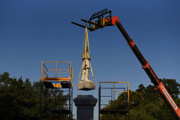 A statue of the Confederate commander, Richard W. Dowling. is removed in Houston, on Wednesday.Credit...