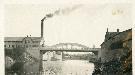 A bowstring bridge once spanned the Grand River in Fergus in the same place that the current St. David Street bridge does today. (Wellington County Museum and Archives) 