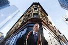 BERNARD WEIL / TORONTO STAR - Clayton Smith, who runs Commercial Realty Group, is busy refurbishing historic Toronto buildings, such as the Dineen Building behind him at Yonge and Temperance St. 