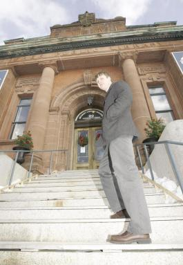 Cindy Wilson/Telegraph-Journal. Kurt Peacock, researcher and member of the Saint John Heritage Development Board, stands on the steps of the Saint John Arts Centre. 