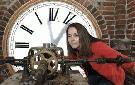 Ridgeway Public School principal Lynn Tisi looks at the gear mechanism of the 89-year-old clock tower atop the school. The four-faced time-piece has been a historic landmark in the town. Mike DiBattista The Review