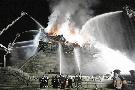 Associated Press - Firefighters battled an arsonist's fire at Namdaemun, a gate of the wall that once surrounded Seoul, in 2008.