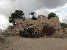 One of six vehicles destroyed by a NATO strike outside the relatively untouched Roman fort at Ras Almargeb, Libya in 2011. Photo: © Joseph Kila