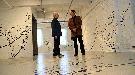 Barbara Luderowski and Michael Olijnyk stand in Written Room, one of the latest installations at the Mattress Factory. The art museum is an economic driver in Pittsburgh. Local arts advocates say it could work here too. (Samantha Craggs/CBC)