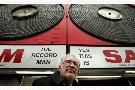 Sheldon Levy in Front of Sam's Sign